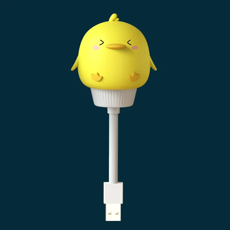 Cute cartoon animal USB night light in bear shape with soft white glow on a bedside table.