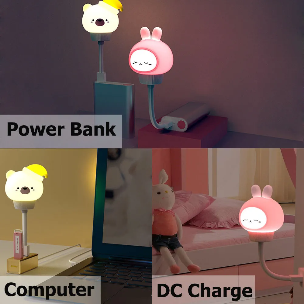 Cute cartoon animal USB night light in bear shape with soft white glow on a bedside table.