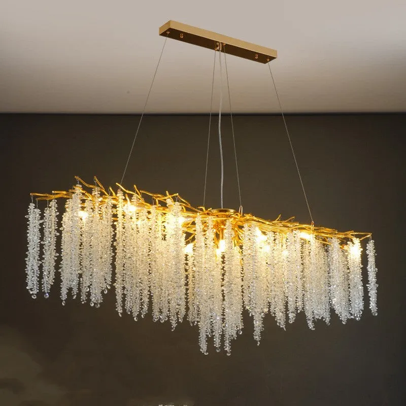 Modern crystal and aluminium alloy LED chandelier light fixture with adjustable height.