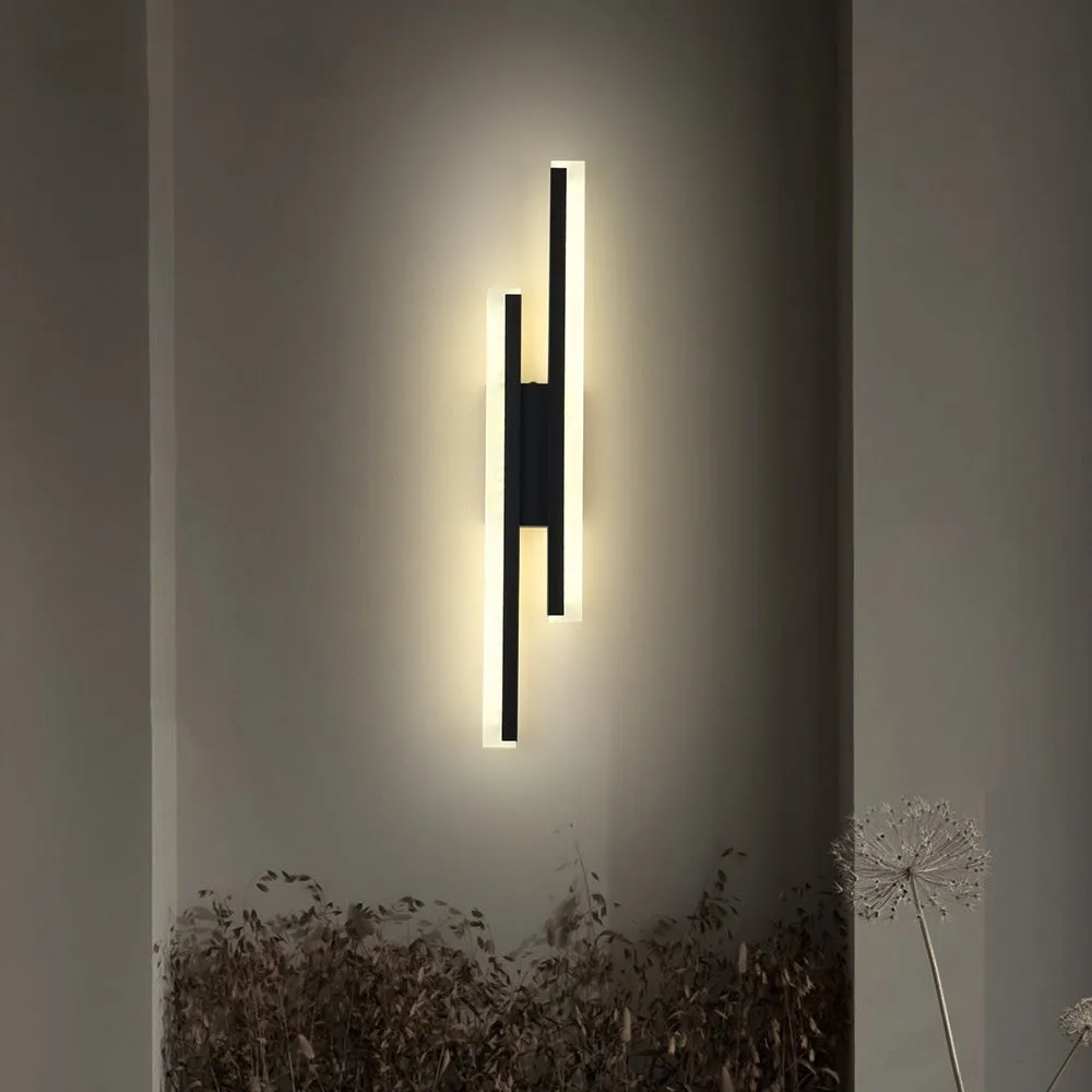 Gold-finished double line wall lamp, 500mm long, with modern design on a white wall.