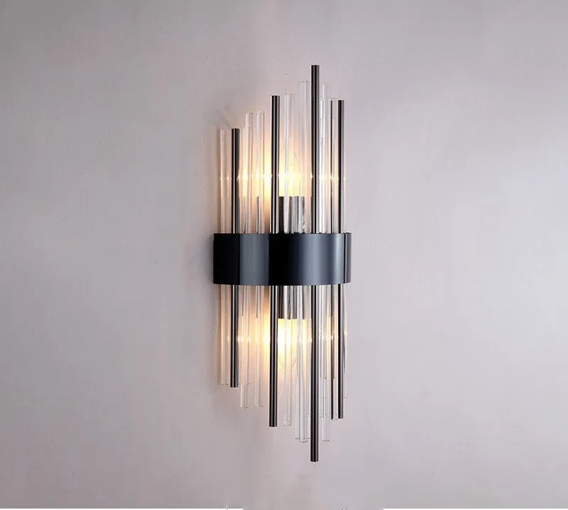 Modern crystal petal wall lamp with metallic gold finish mounted on a light-coloured wall.
