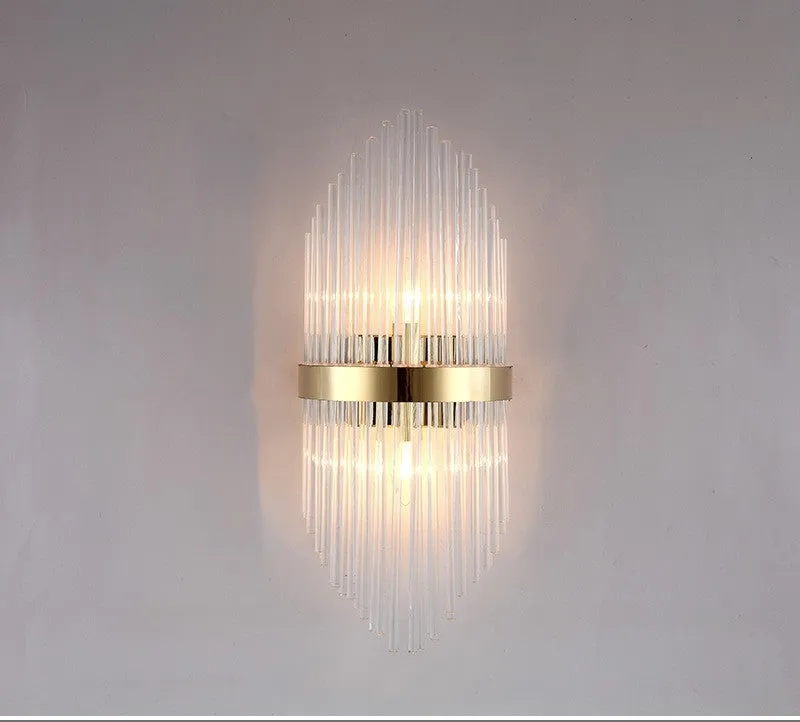 Modern crystal petal wall lamp with metallic gold finish mounted on a light-coloured wall.