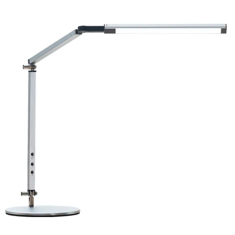 Adjustable LED desk lamp with clip attachment in black finish on wooden desk