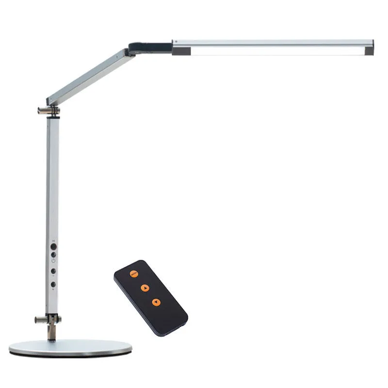 Adjustable LED desk lamp with clip attachment in black finish on wooden desk