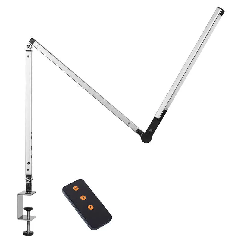 Adjustable LED desk lamp with clip attachment in black finish on wooden desk