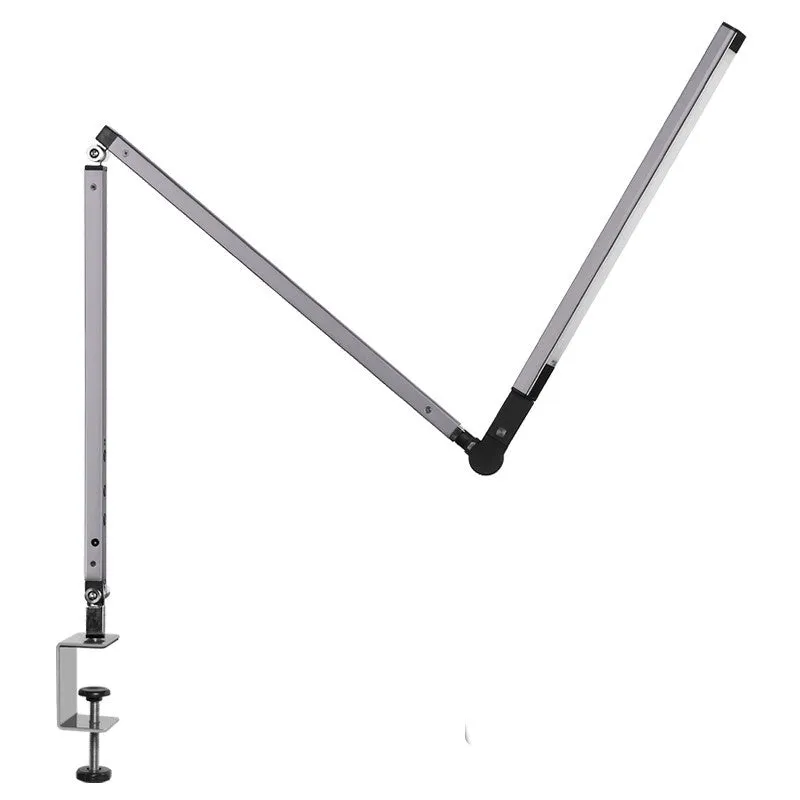 Adjustable LED desk lamp with clip attachment in black finish on wooden desk