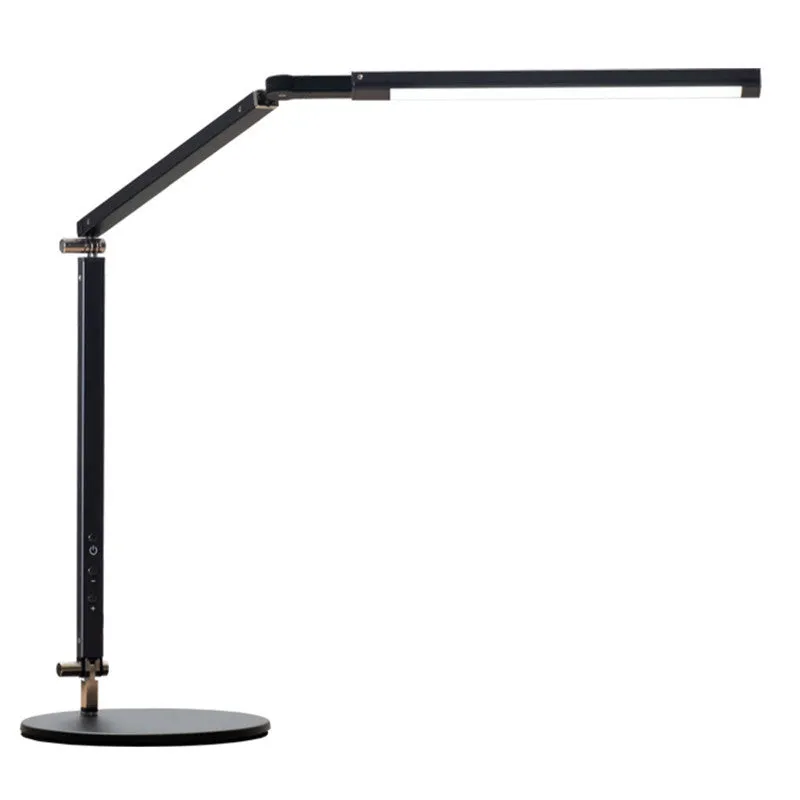 Adjustable LED desk lamp with clip attachment in black finish on wooden desk
