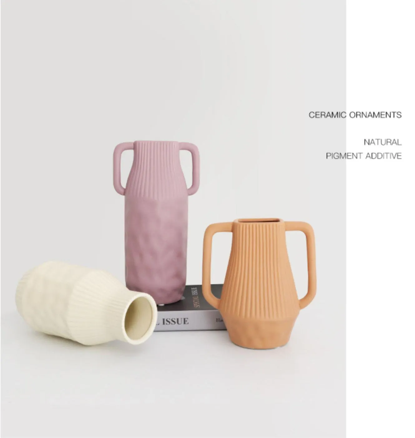 A simple hammer-textured ceramic vase in a Morandi colour on a wooden surface.