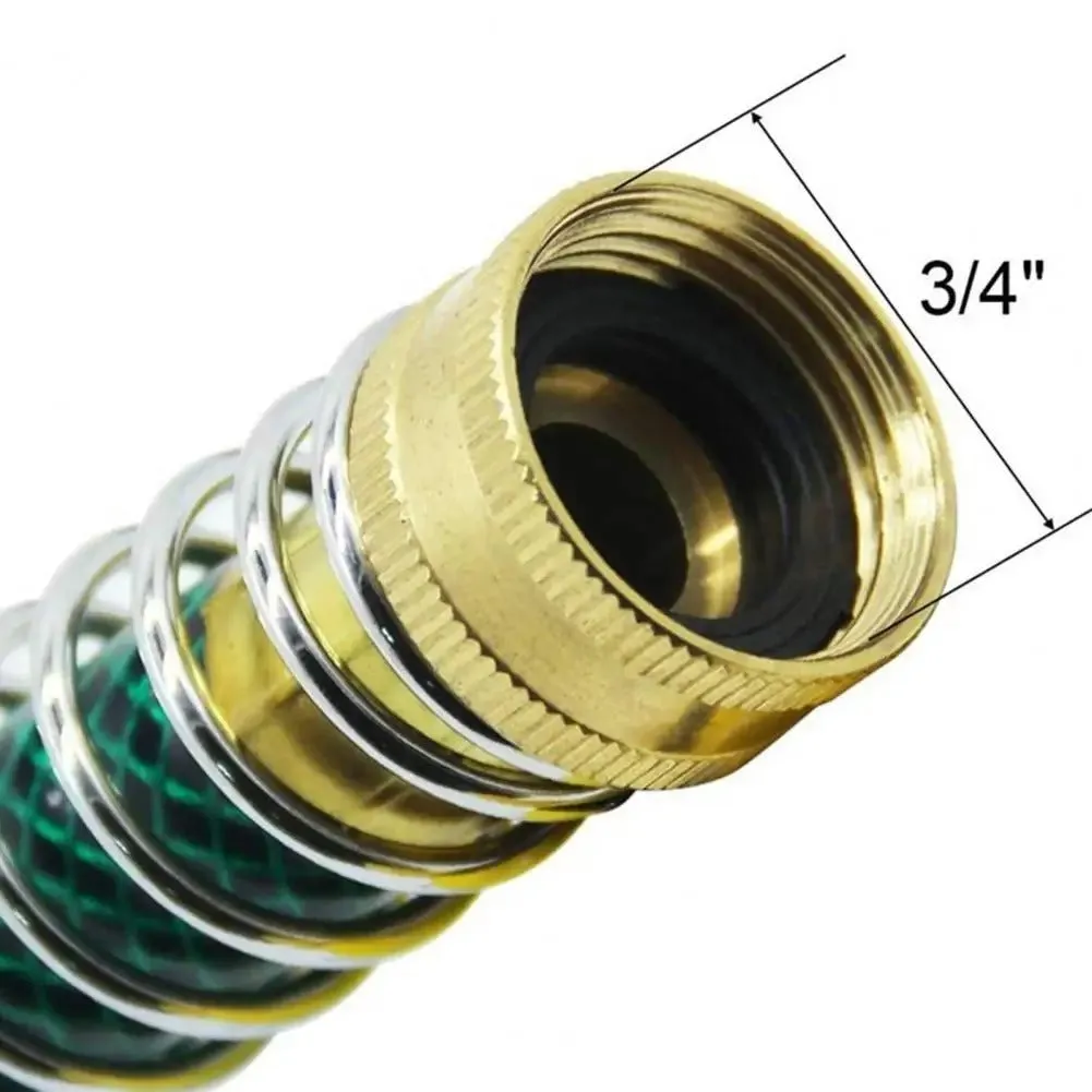 Close-up of a brass spring hose connector showing the spiral spring and 3/4 inch threaded fittings