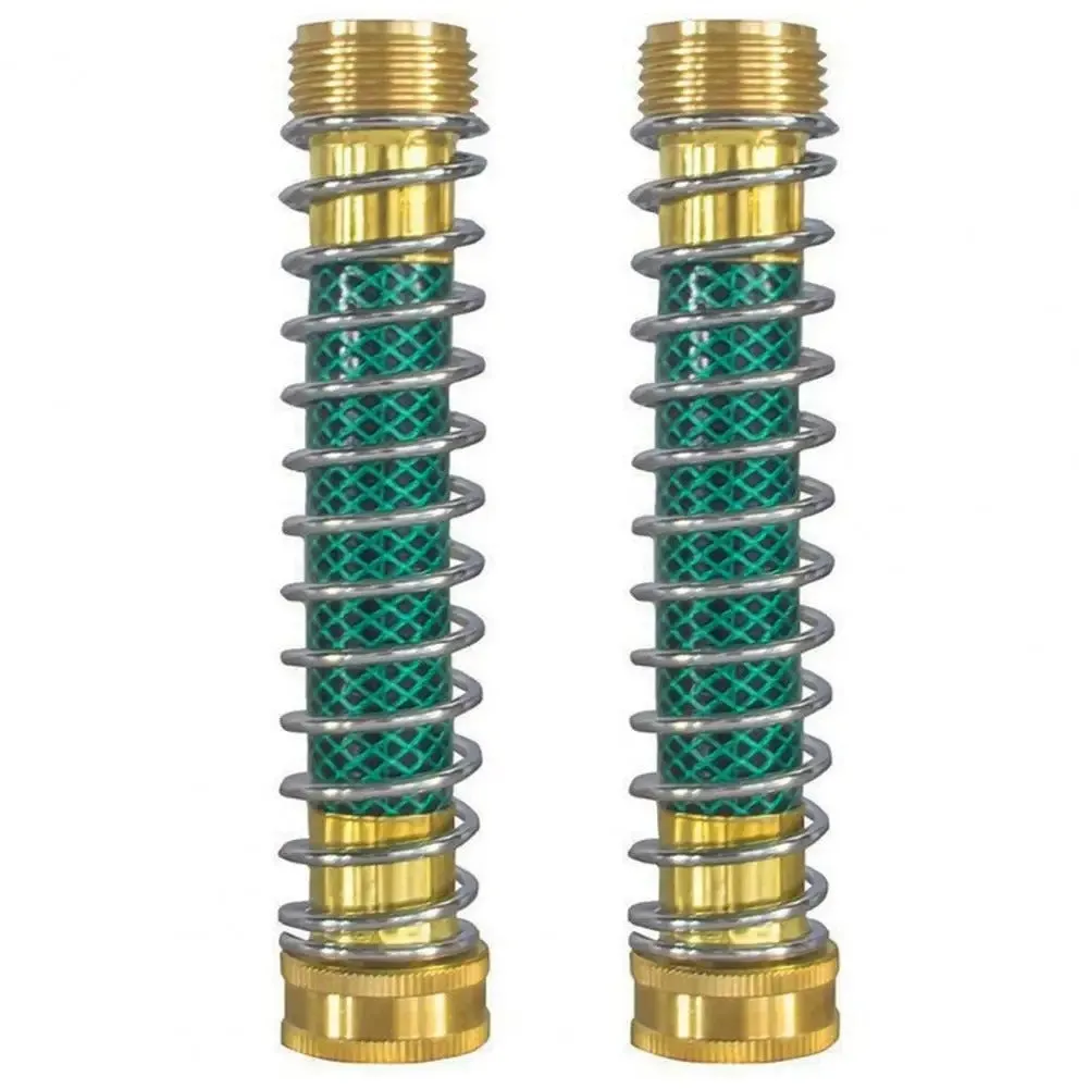 Close-up of a brass spring hose connector showing the spiral spring and 3/4 inch threaded fittings