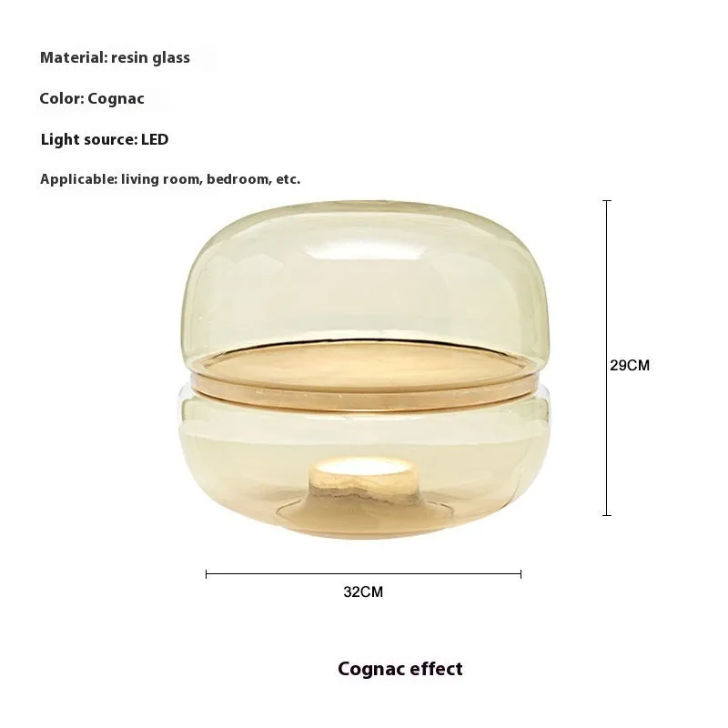 Nordic modern creative table lamp with warm light on a desk