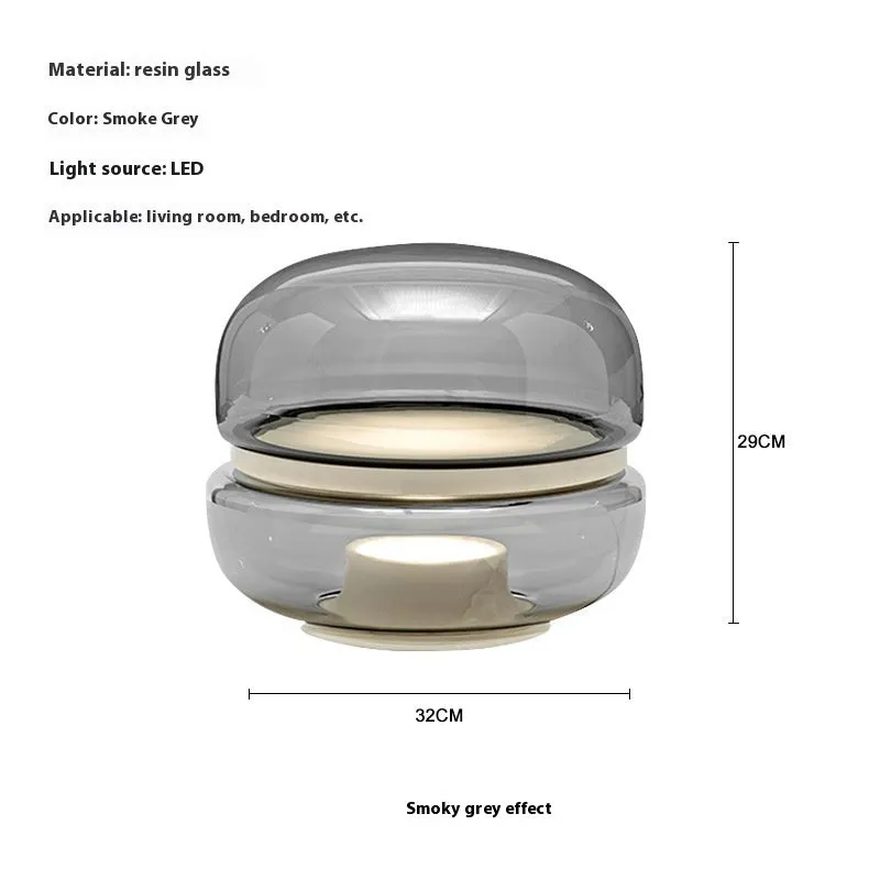 Nordic modern creative table lamp with warm light on a desk