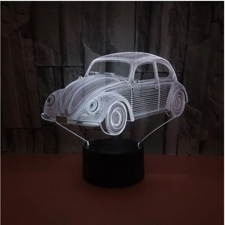 Black 3D acrylic LED table lamp with touch and remote control on wooden desk