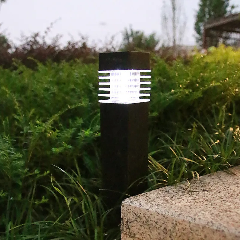 White cuboid solar-powered ground stake light for garden pathways