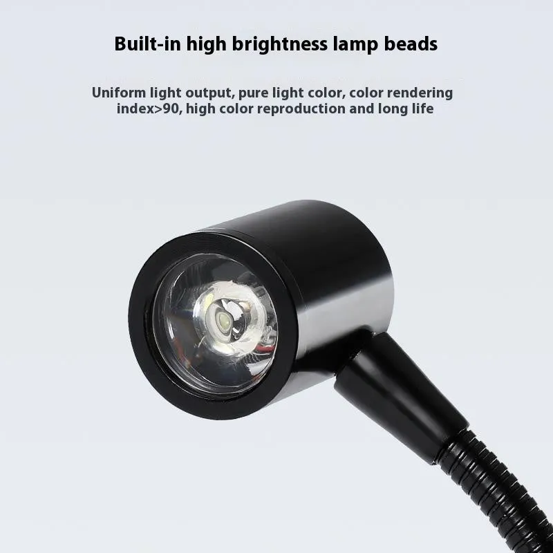 LED moss plant lamp with copper body, USB cable, round base white light, on a desk near a small acrylic fish tank
