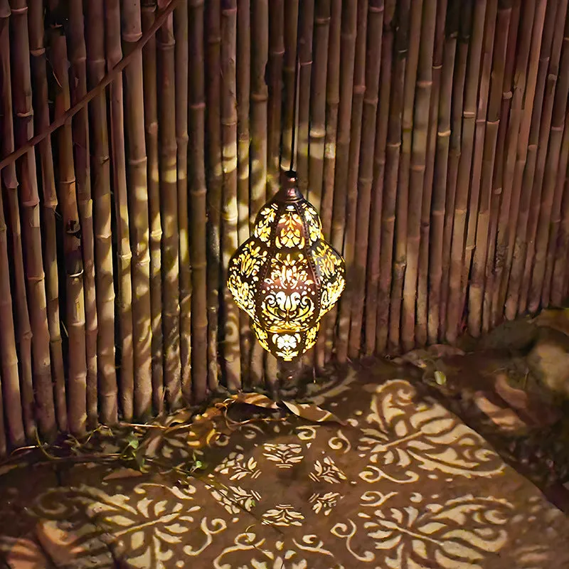 Solar iron hollow lantern chandelier hanging in outdoor courtyard with IP44 waterproof protection
