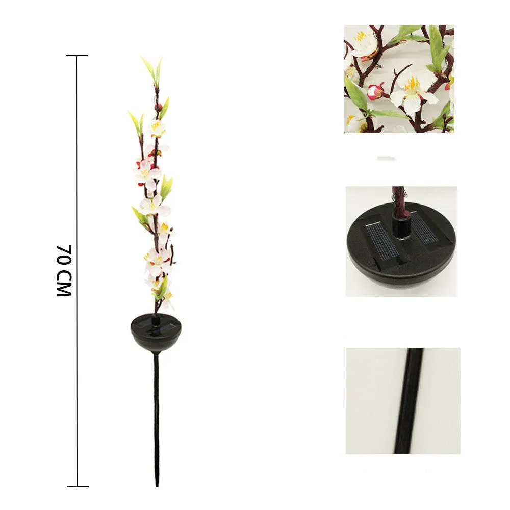 Solar-powered cherry blossom string lights with ground spike for outdoor garden decoration.