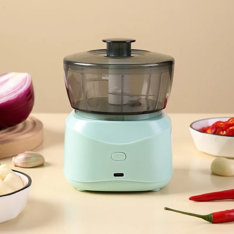 Light blue compact wireless food processor with bowl and blade, 1L capacity, quiet motor