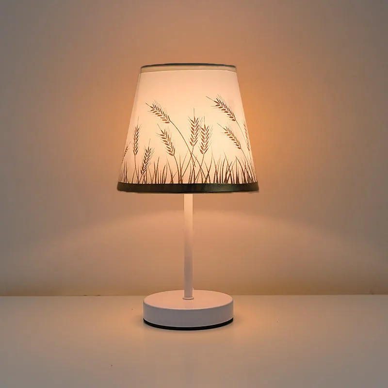 Solid wood fabric bedside lamp with rechargeable touch dimming and three colour light options on a nightstand