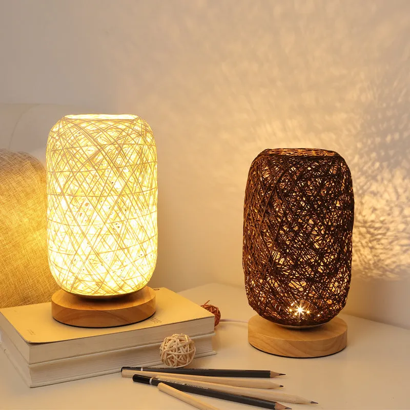 Brown hemp rope sphere desk lamp with wooden base on a desk
