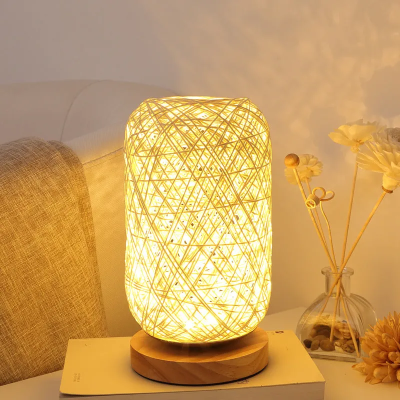 Brown hemp rope sphere desk lamp with wooden base on a desk