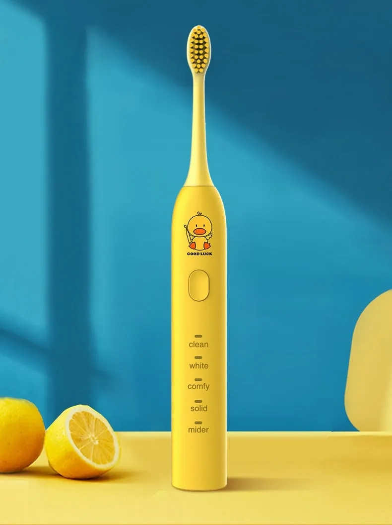 Yellow USB rechargeable adult electric toothbrush with small duck design and soft bristles.