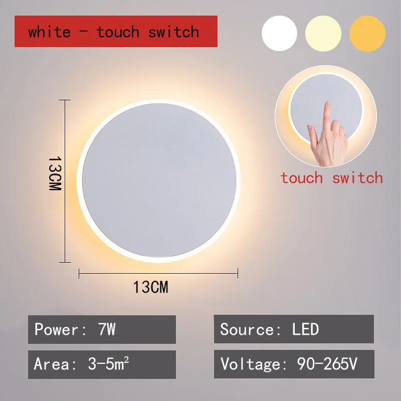 Round LED wall lamp 13cm diameter in black finish for bedside or corridor