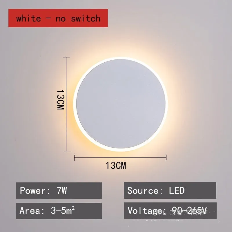 Round LED wall lamp 13cm diameter in black finish for bedside or corridor