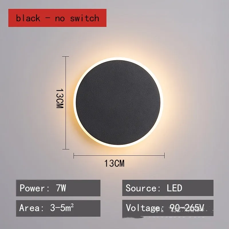 Round LED wall lamp 13cm diameter in black finish for bedside or corridor