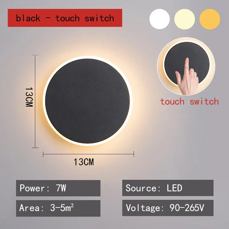 Round LED wall lamp 13cm diameter in black finish for bedside or corridor