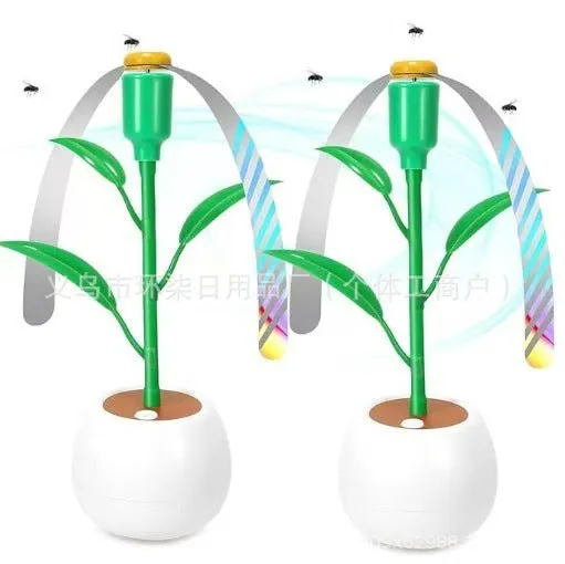 White battery fly repellent fan with curved hose and fruit-shaped design on outdoor table