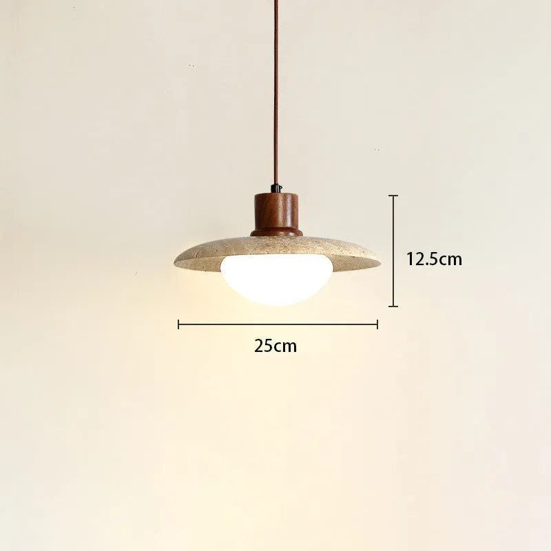 Yellow cave stone wabi sabi style marble bedside pendant light on a wooden surface