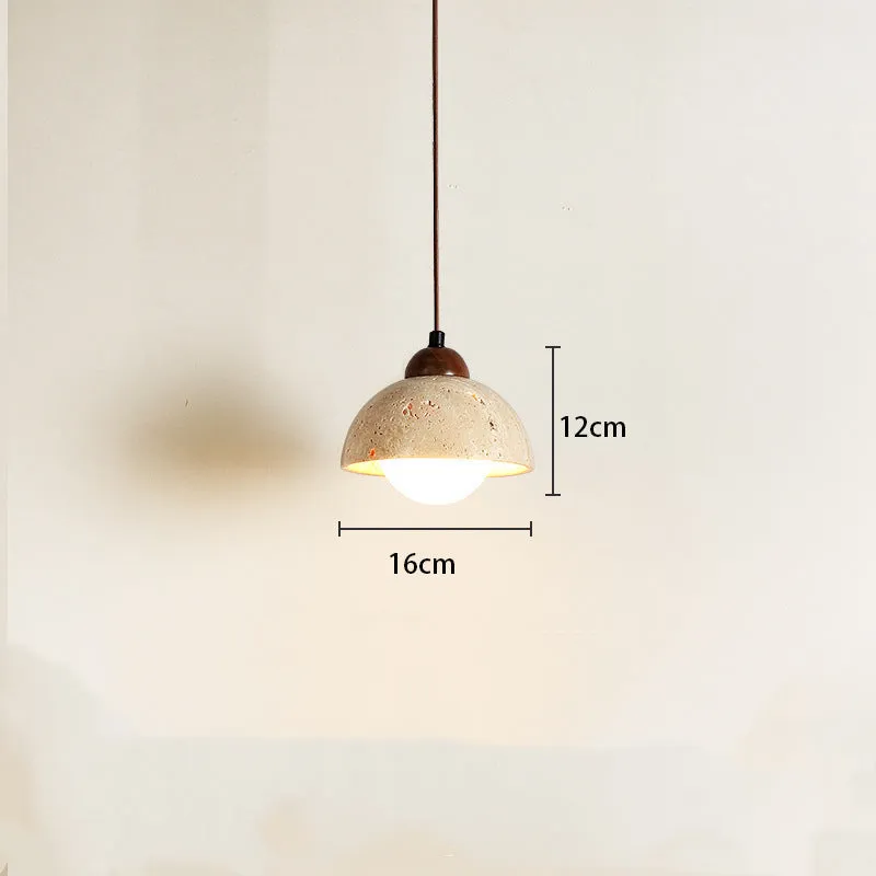 Yellow cave stone wabi sabi style marble bedside pendant light on a wooden surface