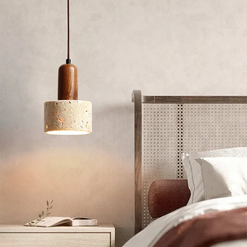 Yellow cave stone wabi sabi style marble bedside pendant light on a wooden surface