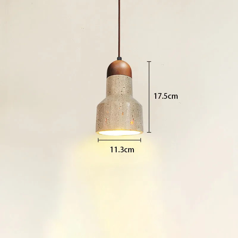 Yellow cave stone wabi sabi style marble bedside pendant light on a wooden surface