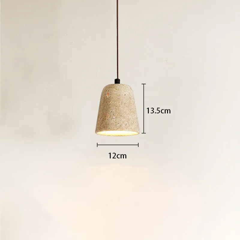 Yellow cave stone wabi sabi style marble bedside pendant light on a wooden surface