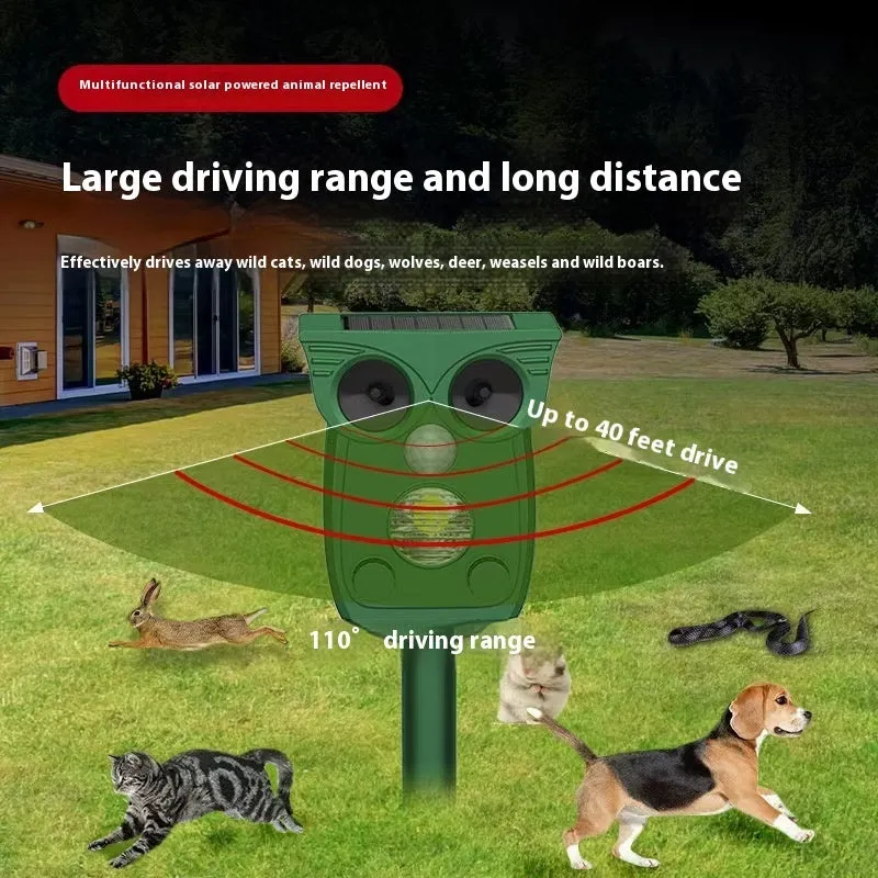 Dark green solar-powered infrared animal repeller with plastic body on grass