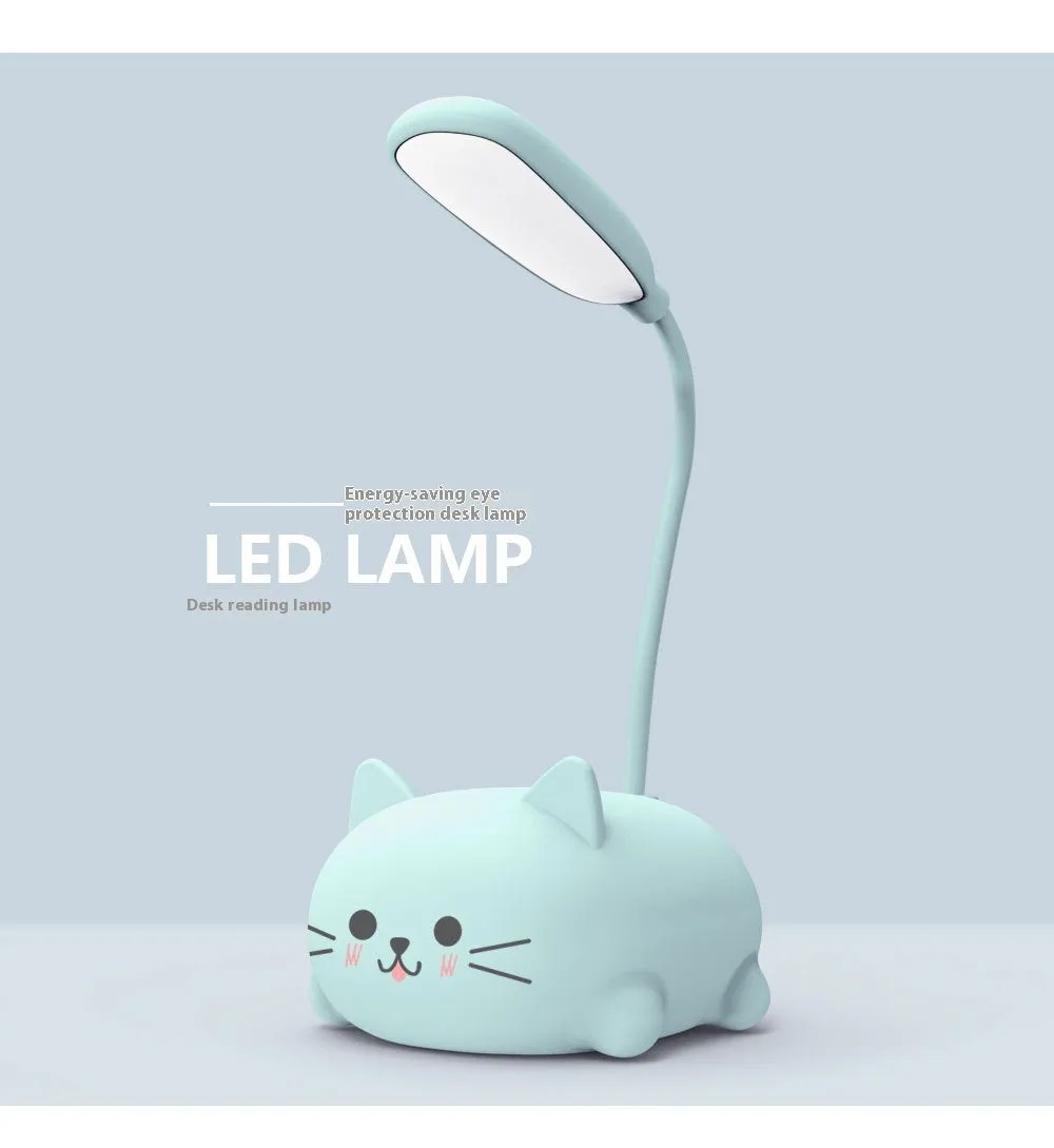 LED cartoon cat desk lamp in pink with USB rechargeable battery and ABS body on a desk