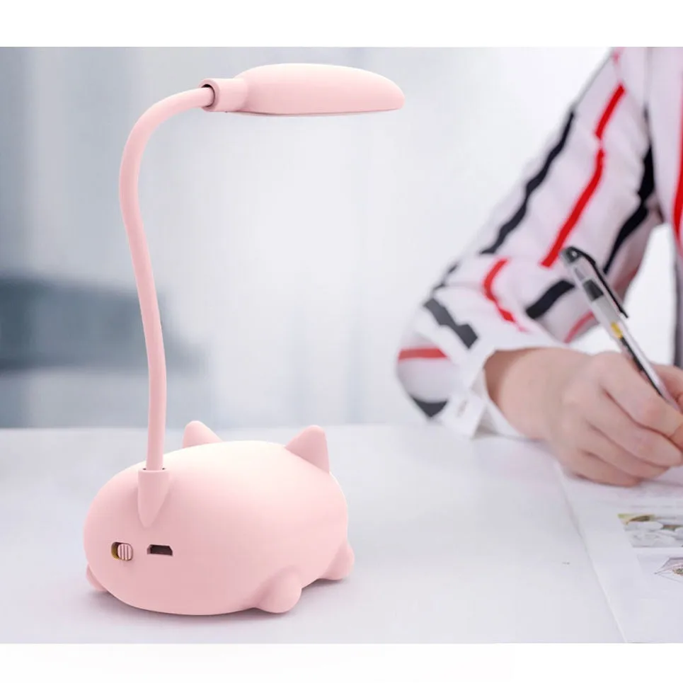 LED cartoon cat desk lamp in pink with USB rechargeable battery and ABS body on a desk