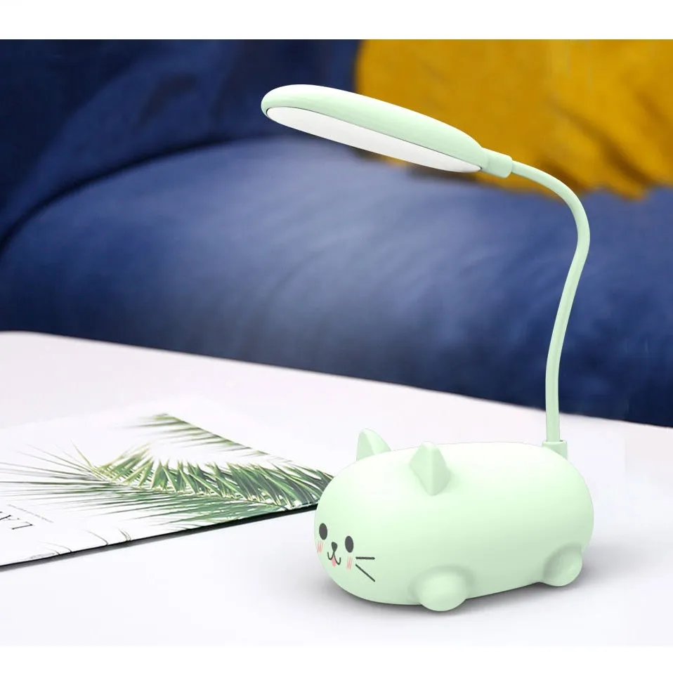 LED cartoon cat desk lamp in pink with USB rechargeable battery and ABS body on a desk