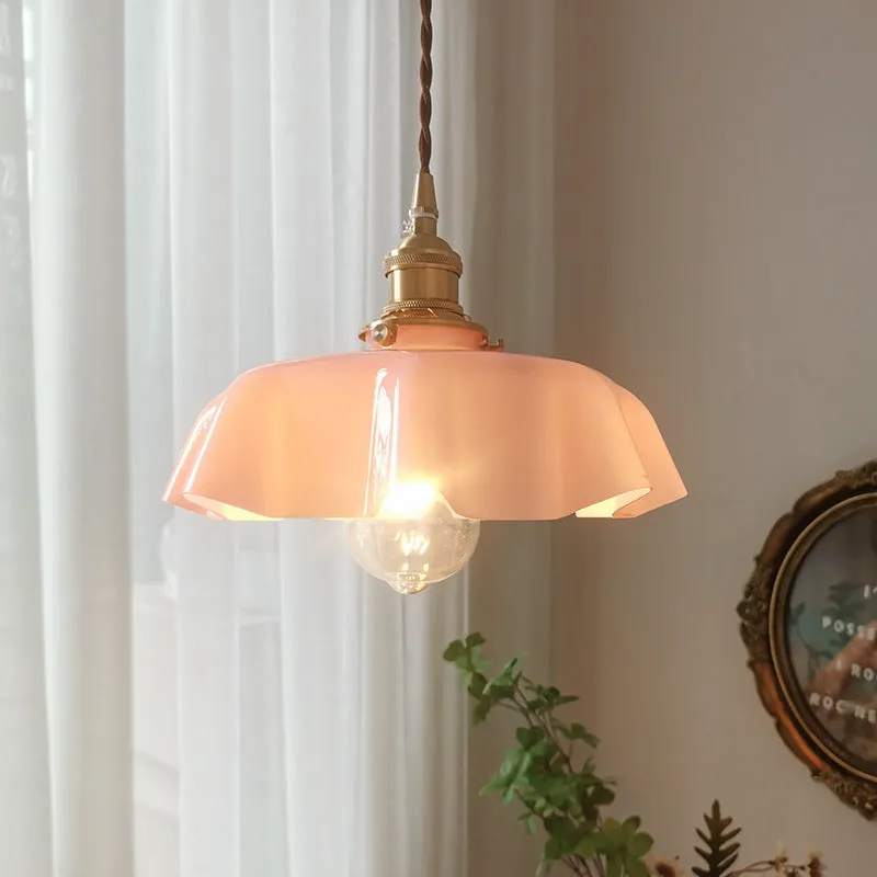 Medieval cream glass chandelier with brass flower bud design, shown with adjustable cord.
