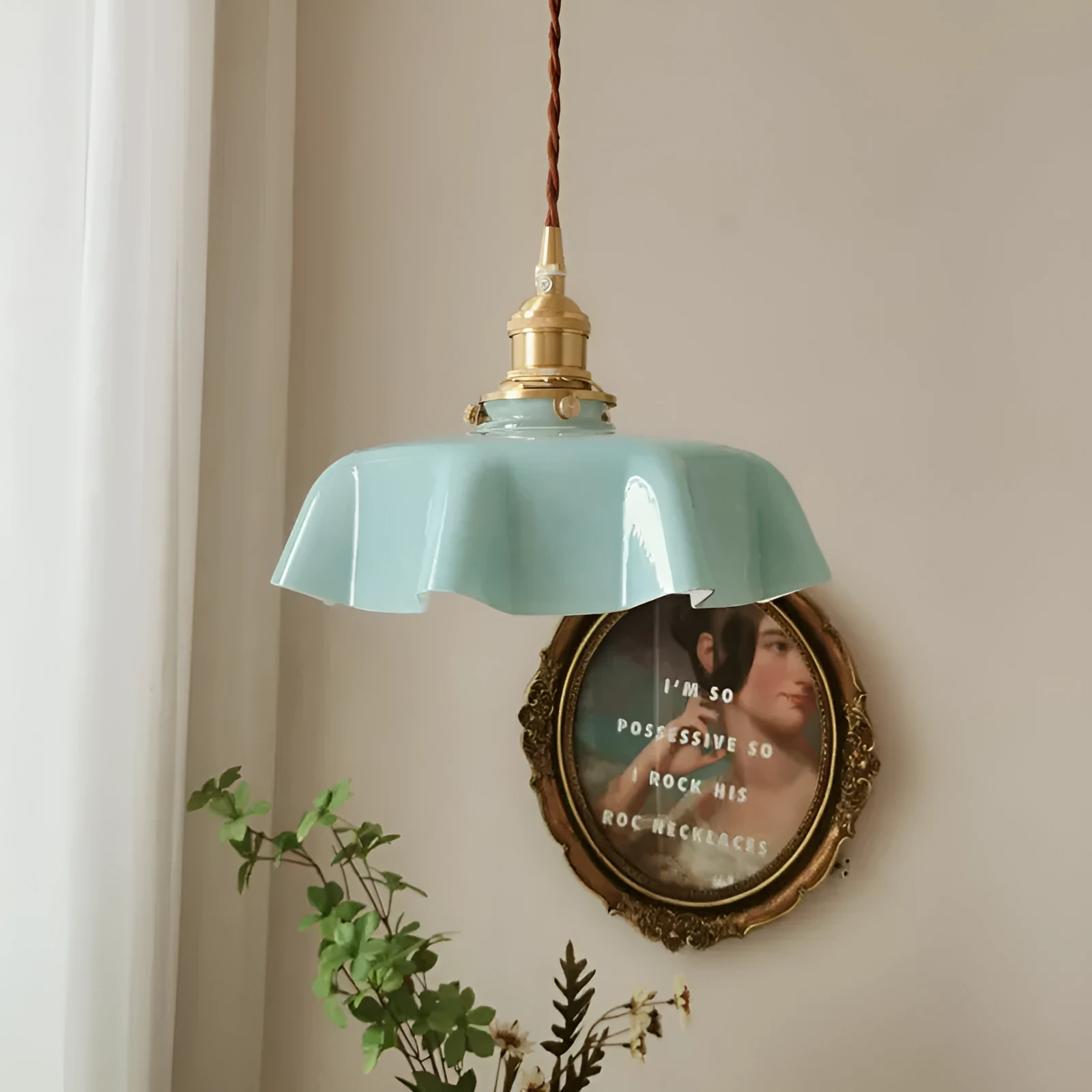 Medieval cream glass chandelier with brass flower bud design, shown with adjustable cord.