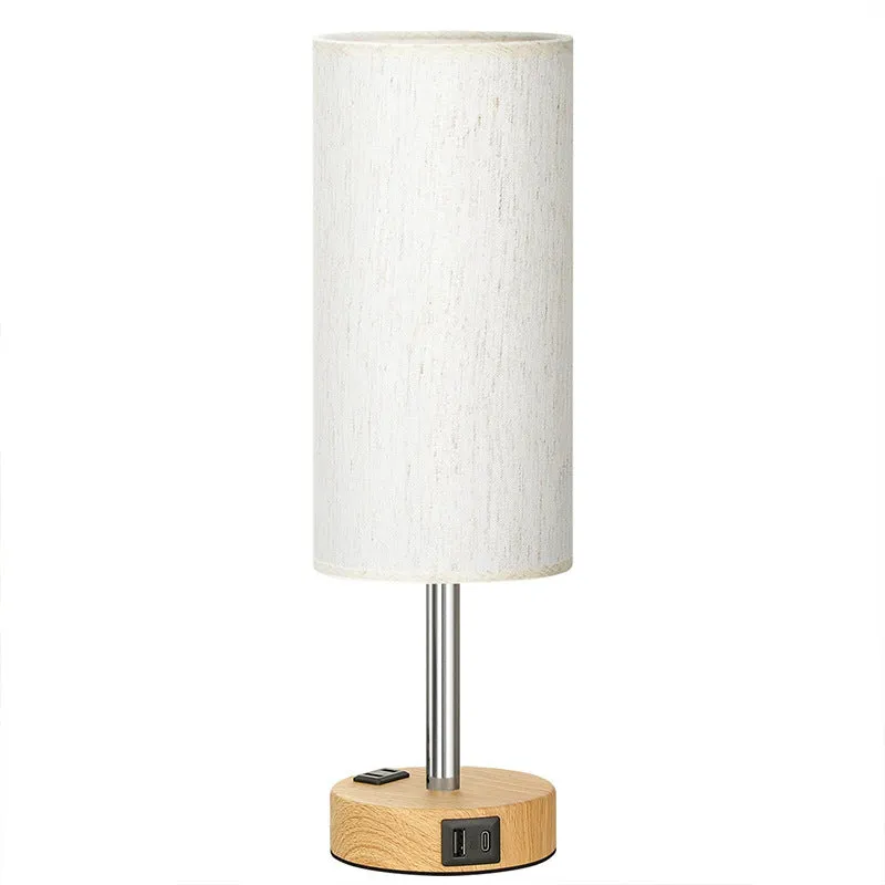 Night Wood Grain table lamp with metal base and three-gear touch dimming on a bedside table