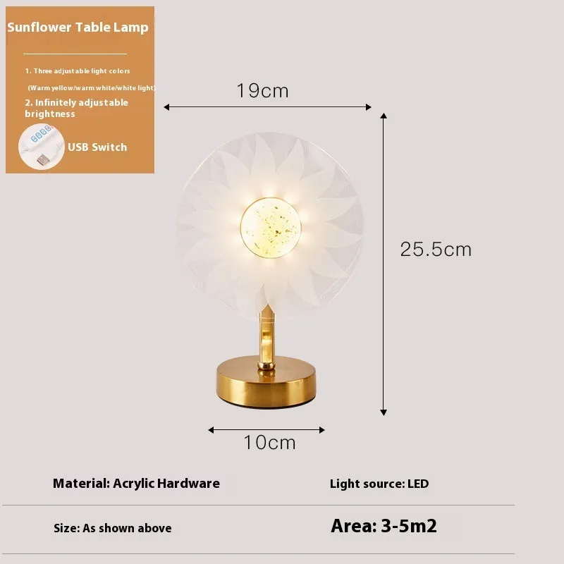 Creative acrylic table lamp with three-colour USB dimming, sunflower shape, on a desk