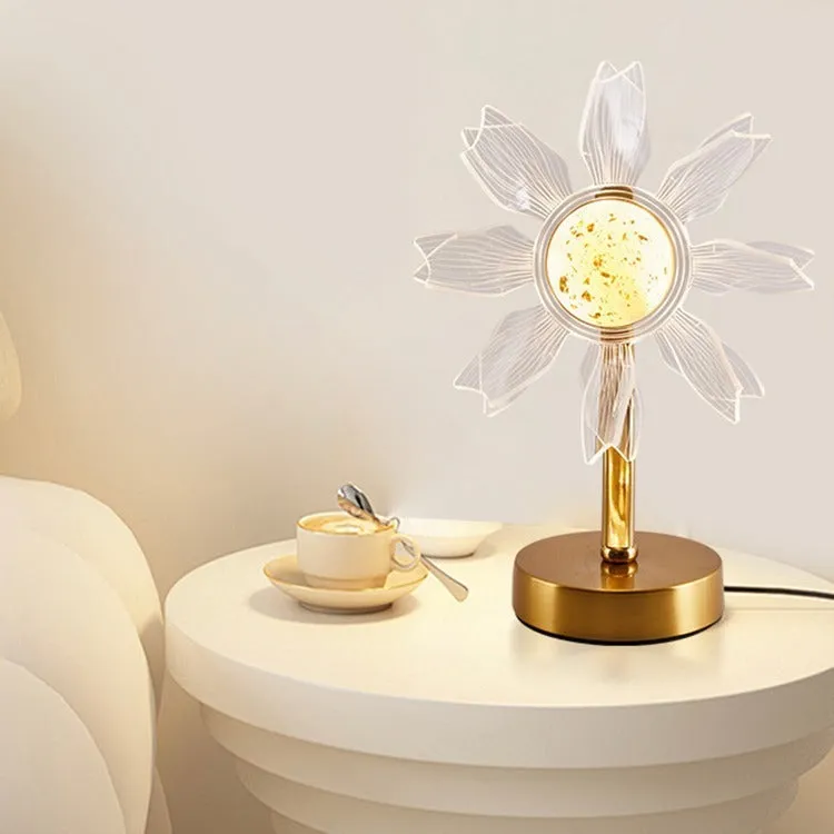 Creative acrylic table lamp with three-colour USB dimming, sunflower shape, on a desk