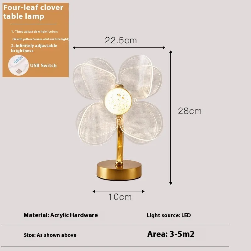 Creative acrylic table lamp with three-colour USB dimming, sunflower shape, on a desk