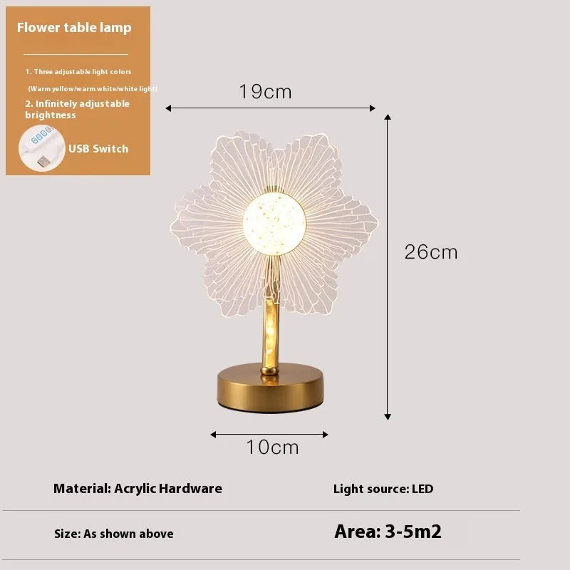 Creative acrylic table lamp with three-colour USB dimming, sunflower shape, on a desk