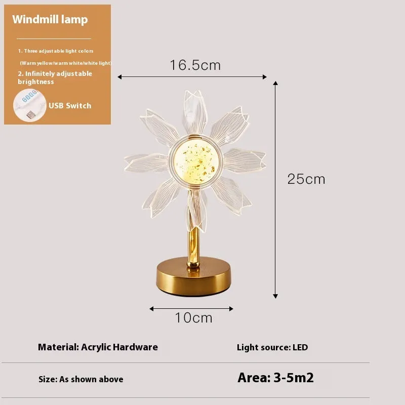 Creative acrylic table lamp with three-colour USB dimming, sunflower shape, on a desk