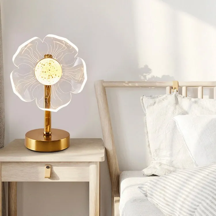 Creative acrylic table lamp with three-colour USB dimming, sunflower shape, on a desk