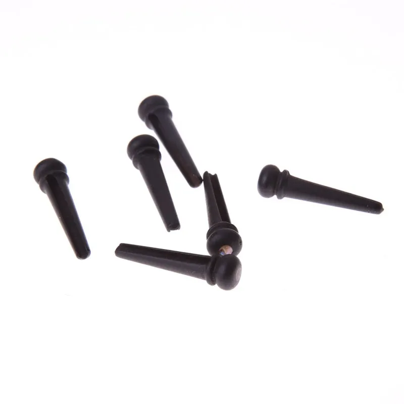 Six ebony folk guitar string nails with 5.3mm bayonet diameter in matt black finish